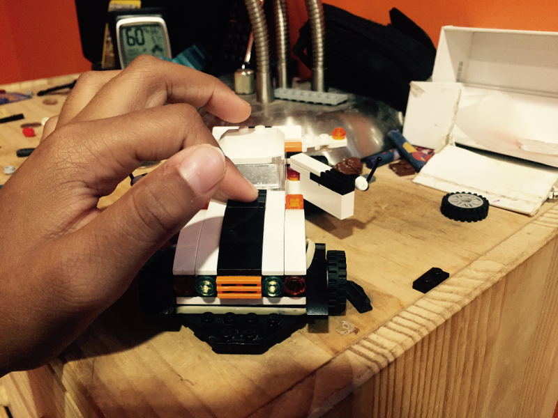 Recently it got headlights and a rubber-band powered windup car setup